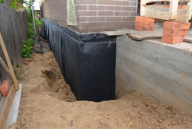 Happy homeowners after waterproofing job in Farmingville
